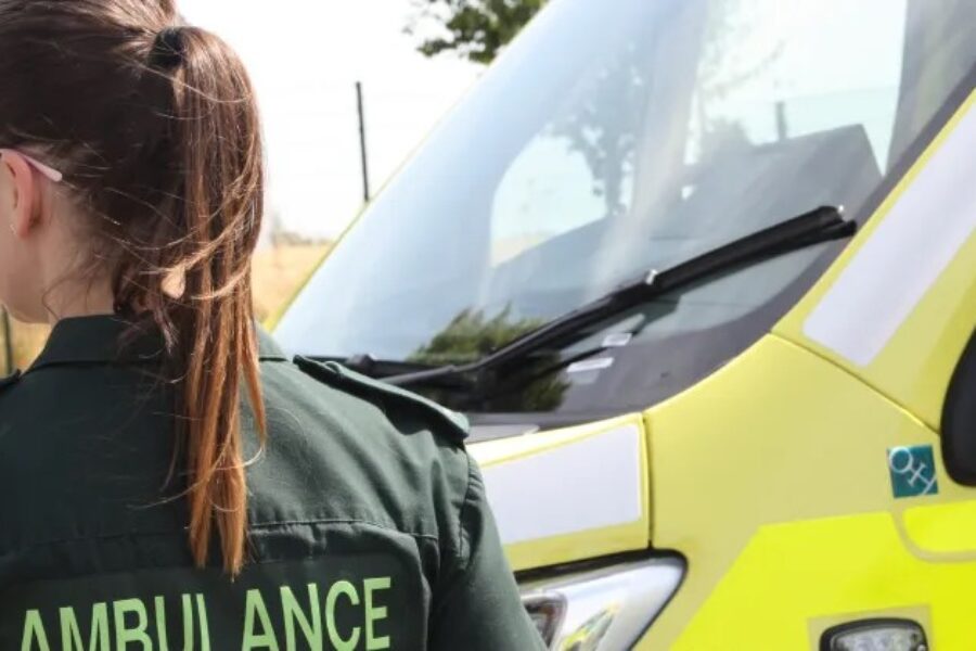 A Paramedic standing in front of an Ambulance